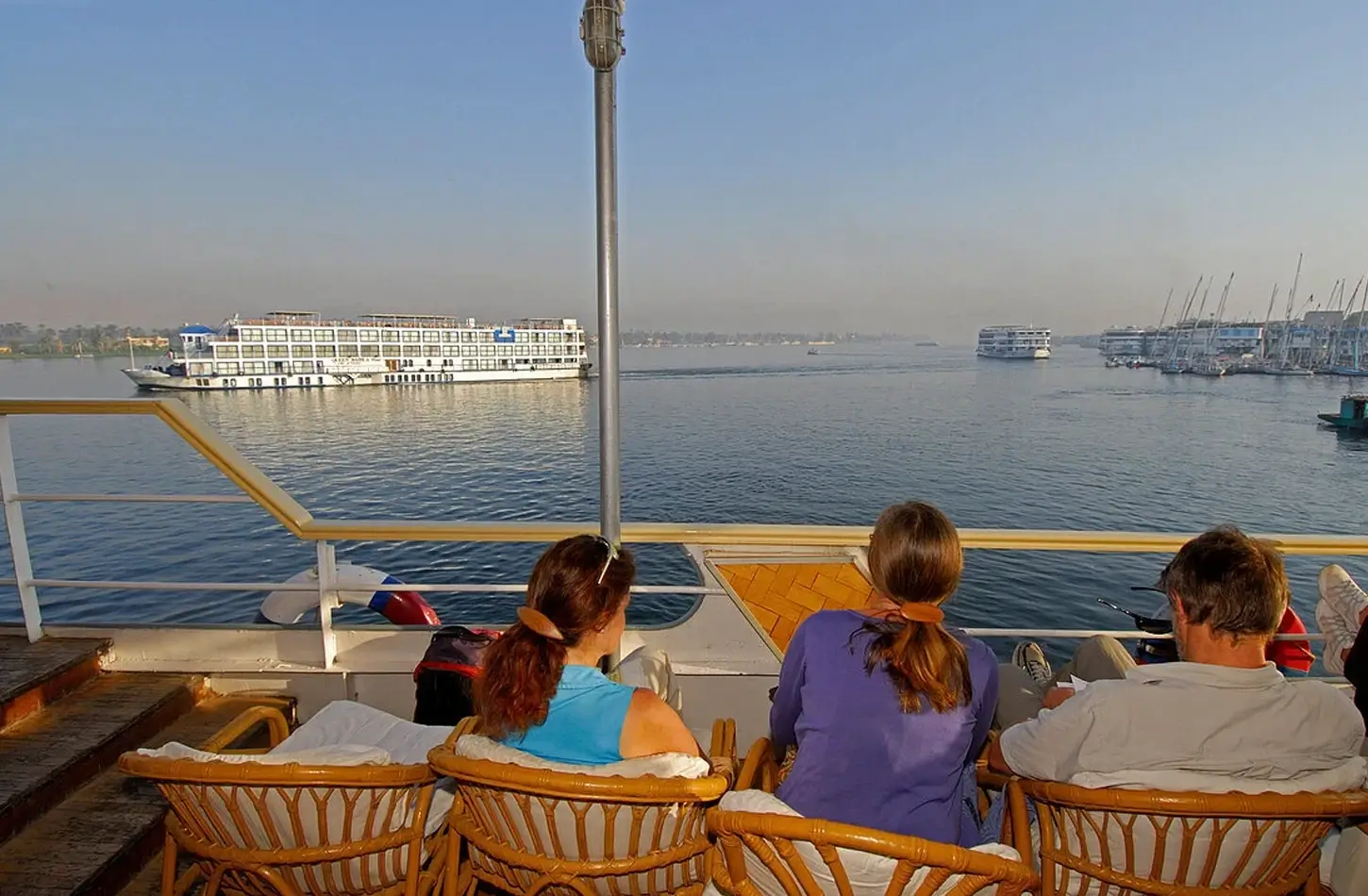 A beautiful picture of a family on the deck of a cruise ship