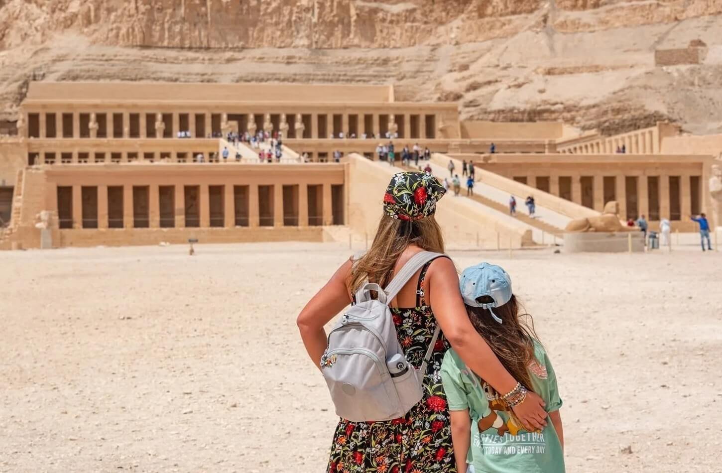 What to Pack for Nile Cruise Egypt: Ultimate Guide 2 A beautiful picture of a woman and her daughter in front of the Temple of Hatshepsut