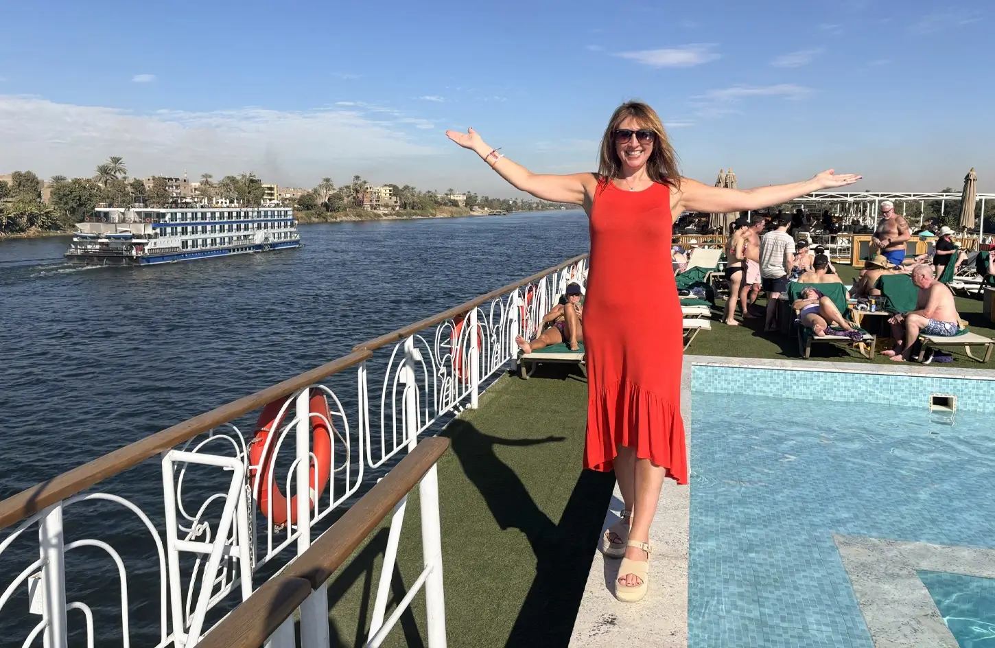 Get Ready: First Time Nile Cruise Tips on Nile Cruise Offers 1 A stunning photo of a tourist standing in front of the swimming pool on the cruise ships deck