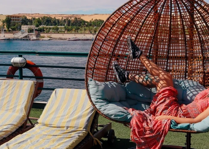 A girl enjoying a swing on a cruise ship deck.