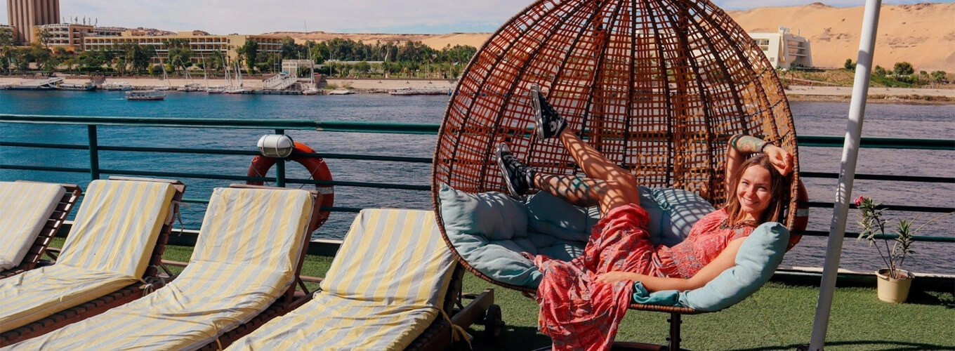 A girl enjoying a swing on a cruise ship deck.