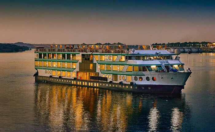 Luxury cruise ship Acamar at sunset on the ocean.