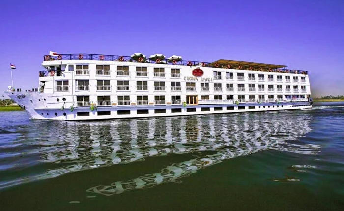 Luxurious Crown Jewel Cruise ship sailing through the ocean waters.