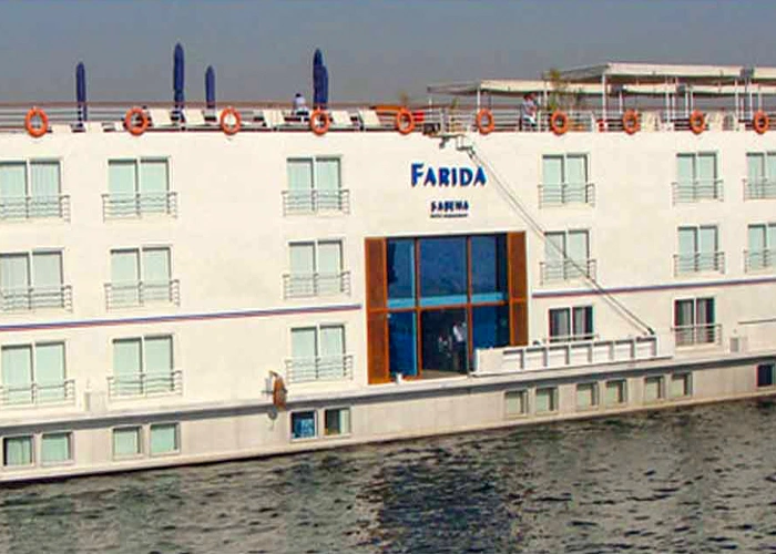A scenic view of the Farida Cruise on the water during sunset.