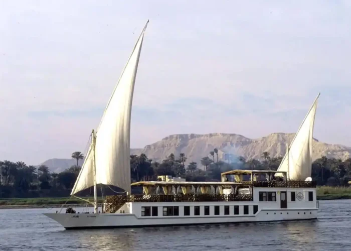 Luxurious Dahabeya sailing on the Nile during sunset