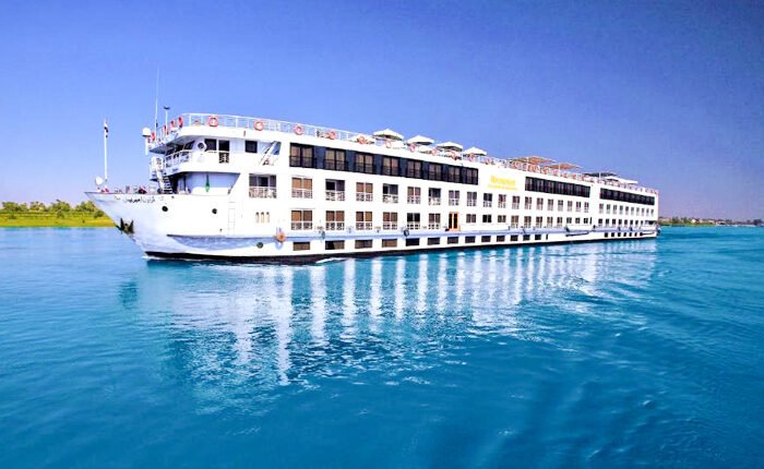 Luxury cruise ship Iberotel Crown Empress navigating the Nile River.