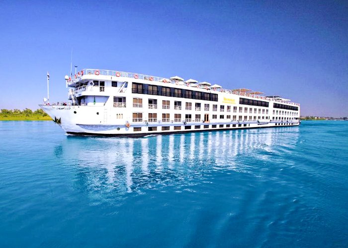 Luxury cruise ship Iberotel Crown Empress navigating the Nile River.
