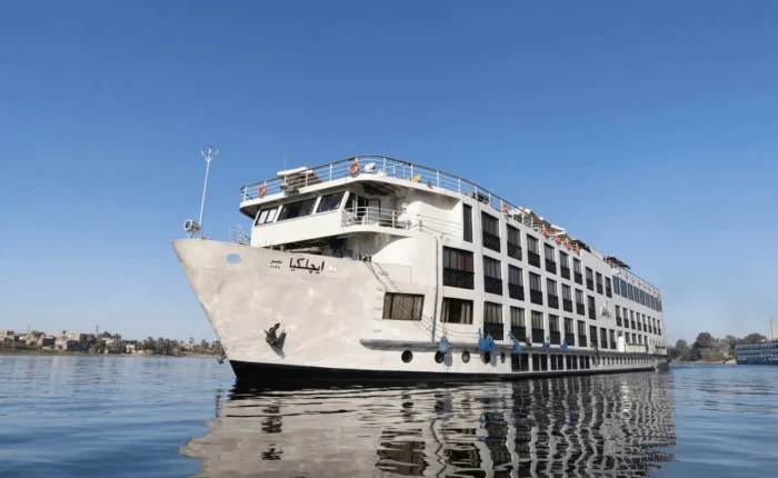 Luxury cruise ship M.S. Kleos sailing on the Nile River between Luxor and Aswan.