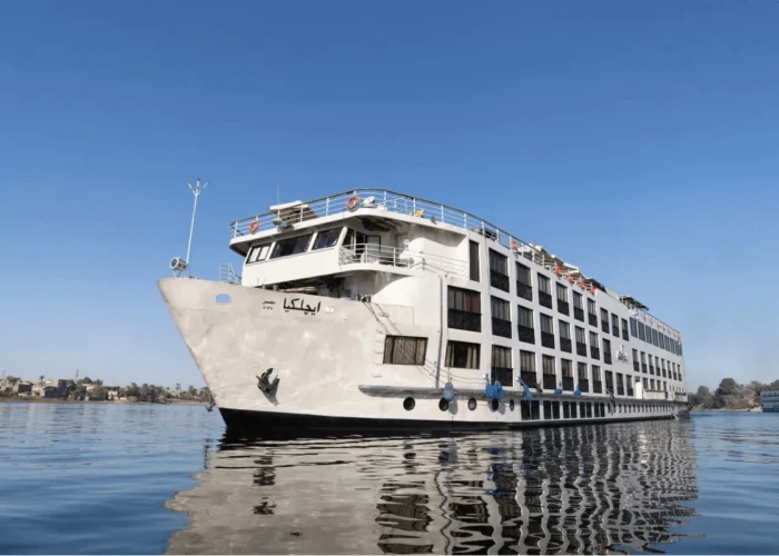 Luxury cruise ship M.S. Kleos sailing on the Nile River between Luxor and Aswan.