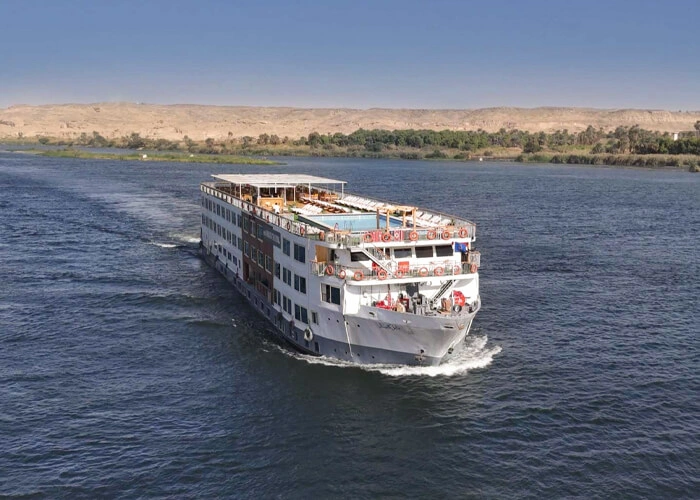 Luxurious cruise on the Nile River showcasing ancient Egyptian landmarks.