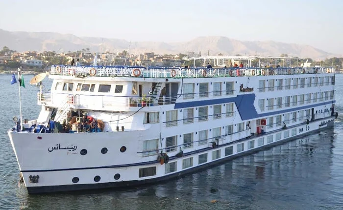 Luxurious Renaissance Nile Cruise boat on the river at sunset.