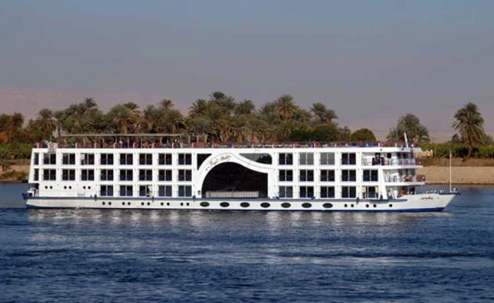 Royal Princess Cruise ship sailing in the ocean under a clear blue sky.