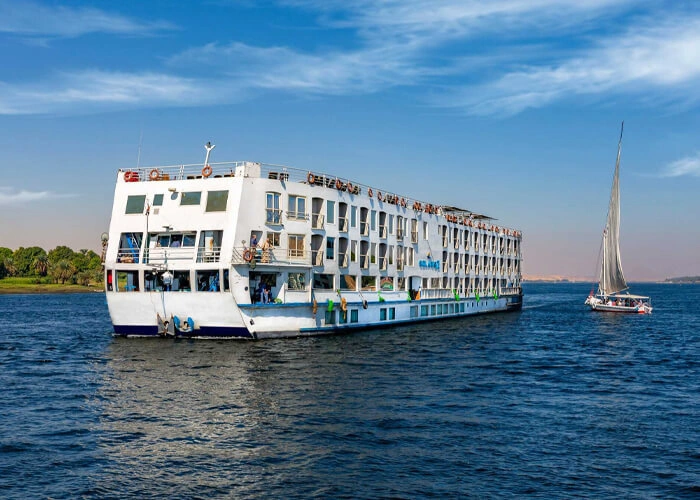 Luxurious Solaris II Nile Cruise boat on the Nile River at sunset.