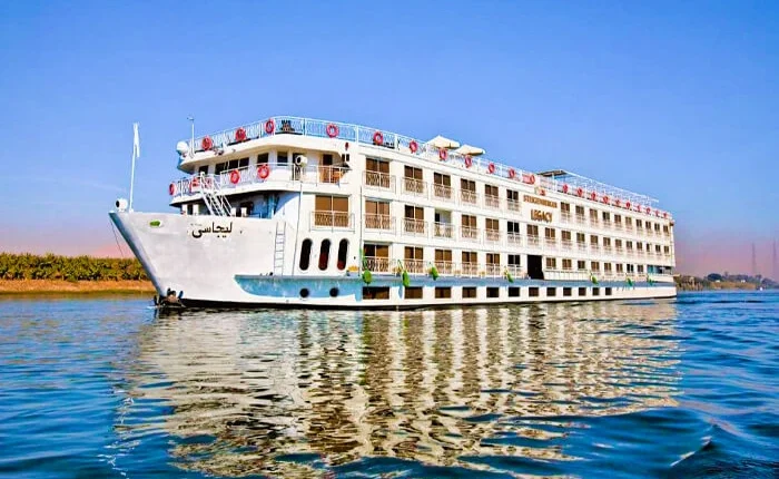 Luxurious cabin on the Steigenberger Legacy Nile Cruise with elegant decor and river views.