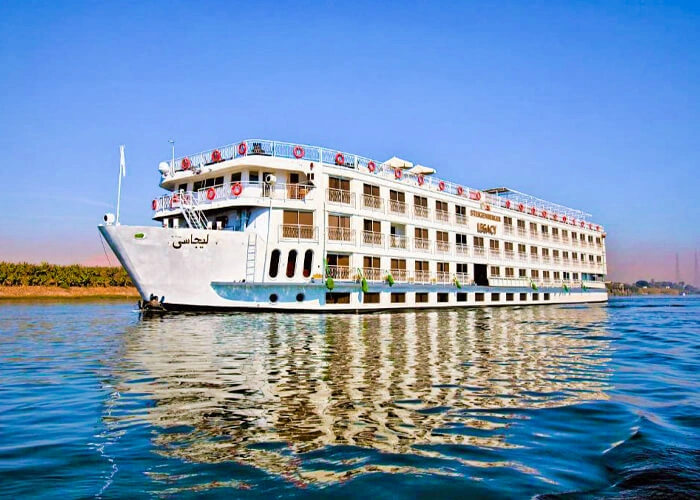 Luxurious cabin on the Steigenberger Legacy Nile Cruise with elegant decor and river views.