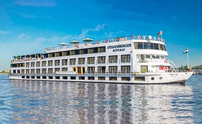 Luxurious Steigenberger Royale cruise ship docked at sunset