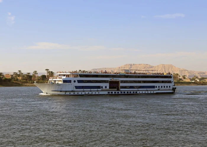 Scenic view of the Blue Shadow Nile cruise with lush landscapes and clear skies.