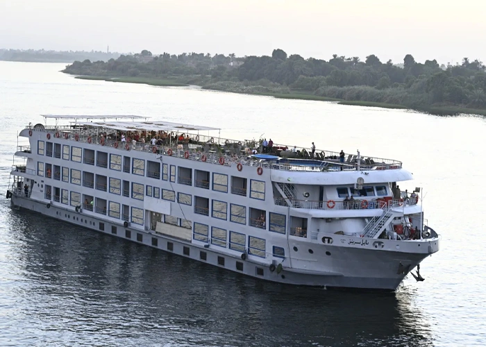 Serenity on a Nile cruise showcasing lush banks and clear waters.