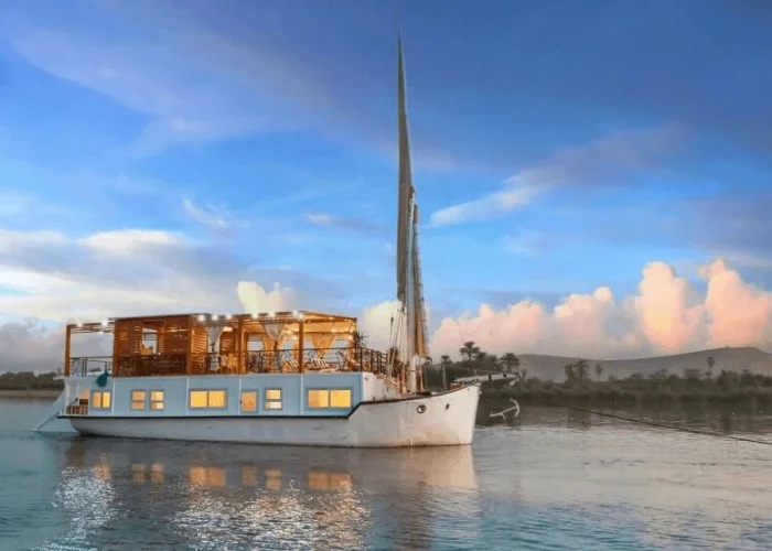 Queen Cleopatra aboard a dahabiya on the Nile River.