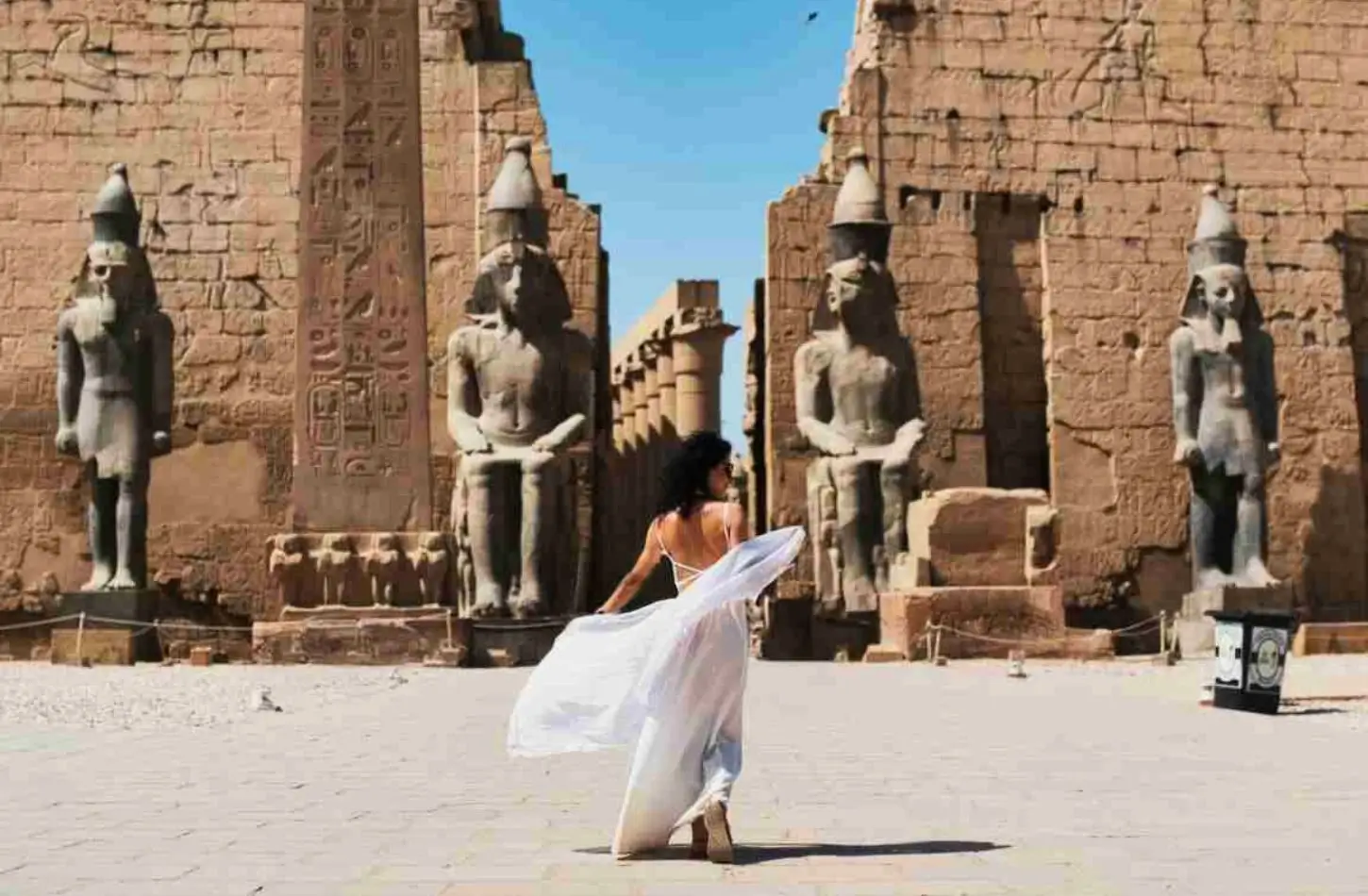 woman walking ancient egyptian ruins