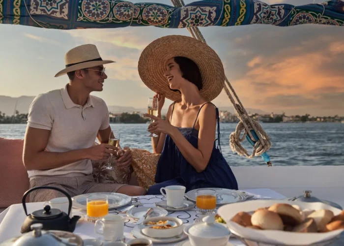 A photo of a couple having breakfast on a rooftop during a trip] - Nile Cruise Reviews