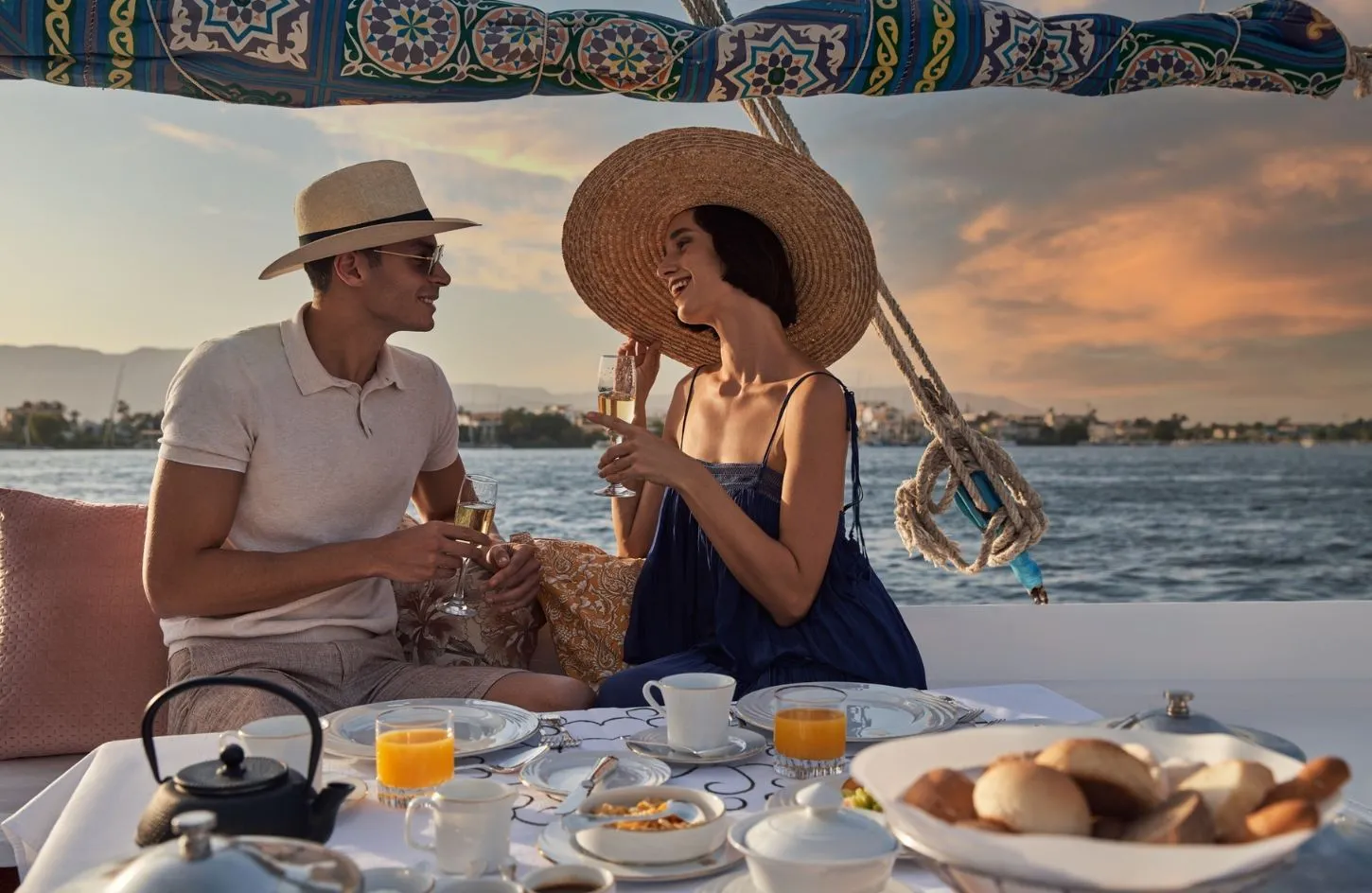 A photo of a couple having breakfast on a rooftop during a trip] - Nile Cruise Reviews